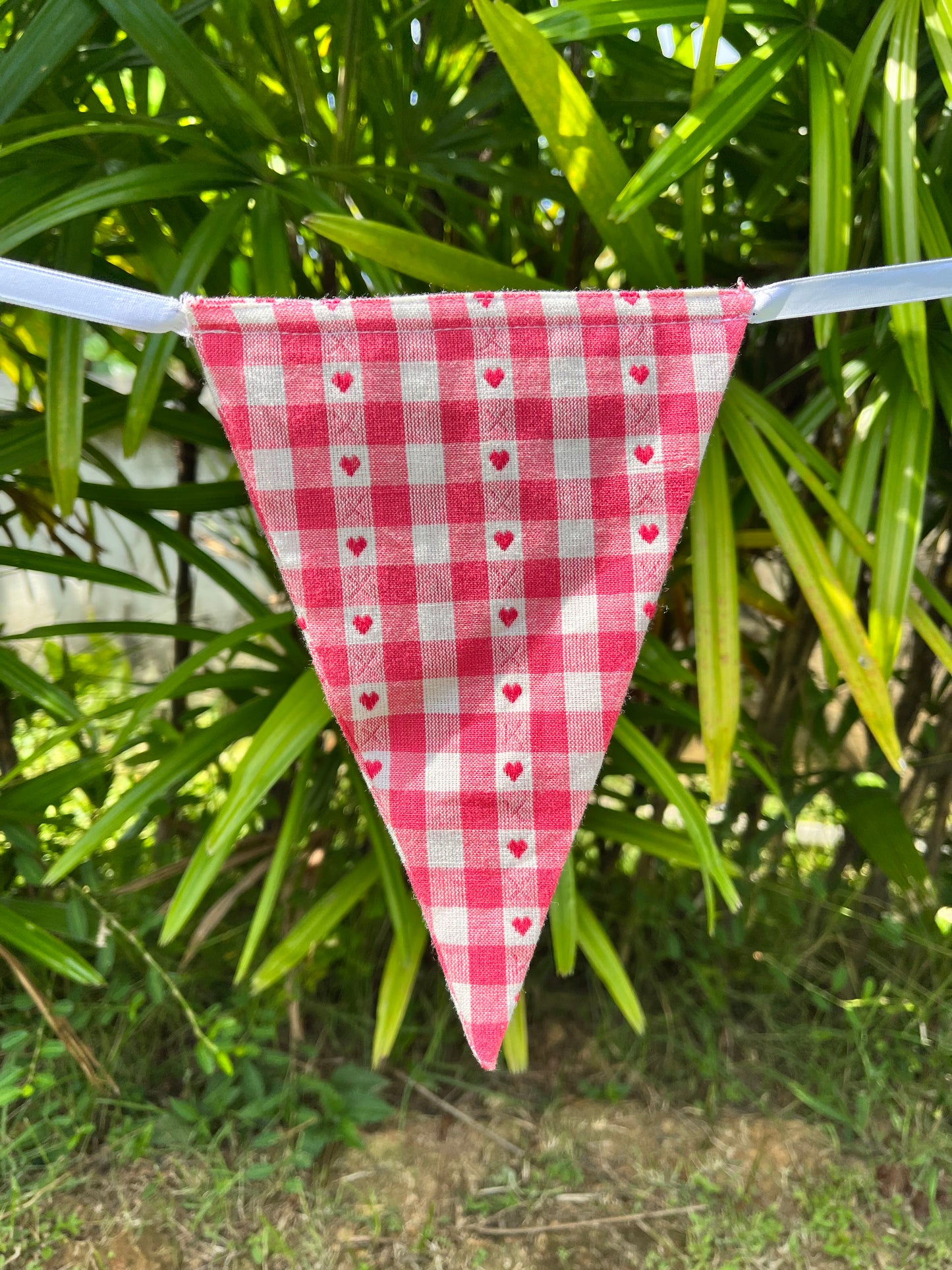 Amish red gingham flag with red embroidered hearts, from Turquaz.