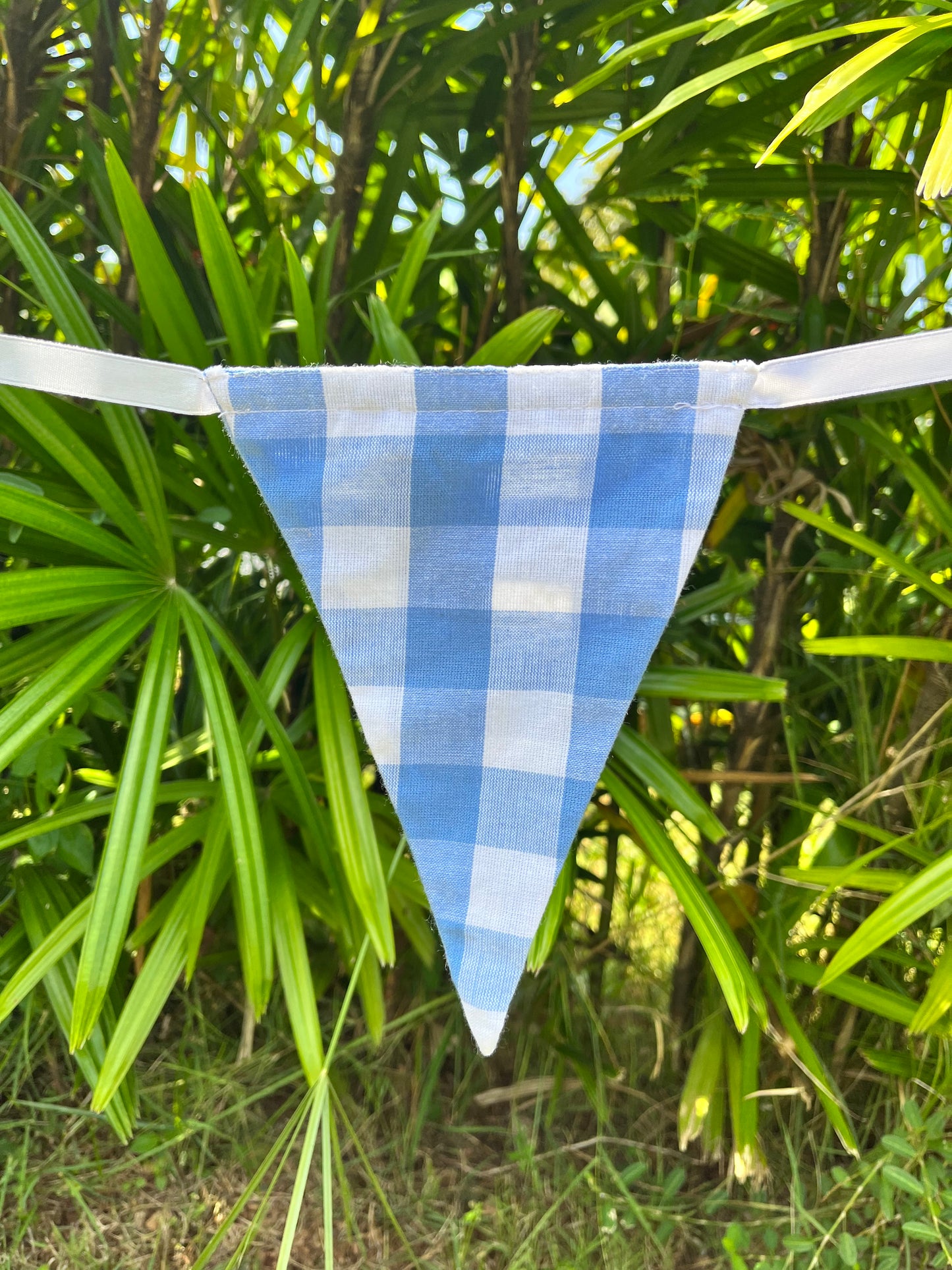 Close up of blue and white checked flag on Balloo bunting from Turquaz.