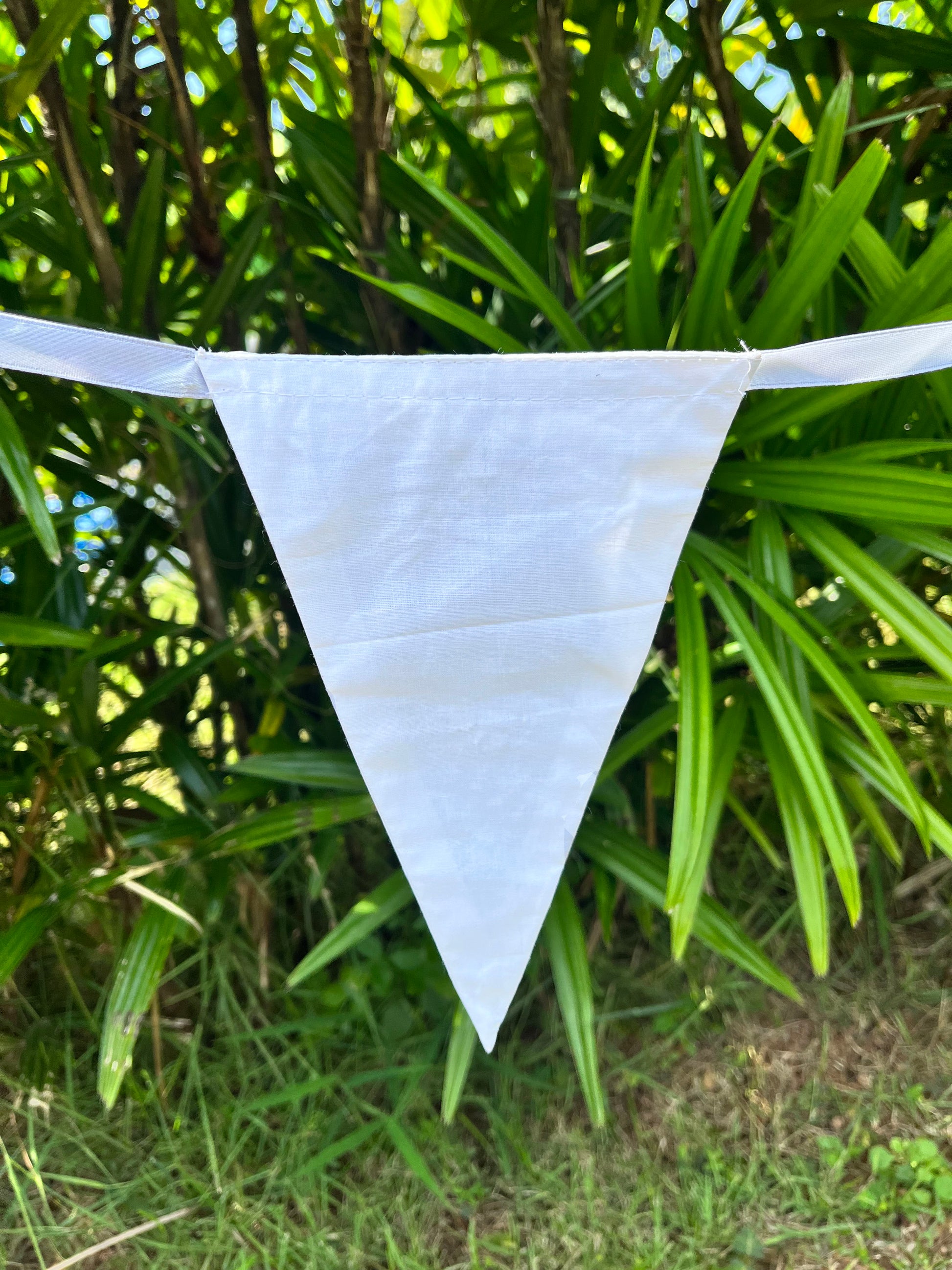 Close up of white flag on Balloo bunting from Turquaz.