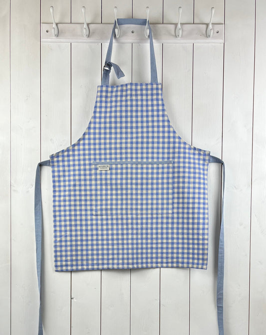Blue gingham apron for children with large front pocket and adjustable neck strap.  TurQuaz.