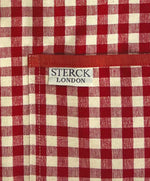 Close up of pocket detail on child ziro red apron from TurQuaz.