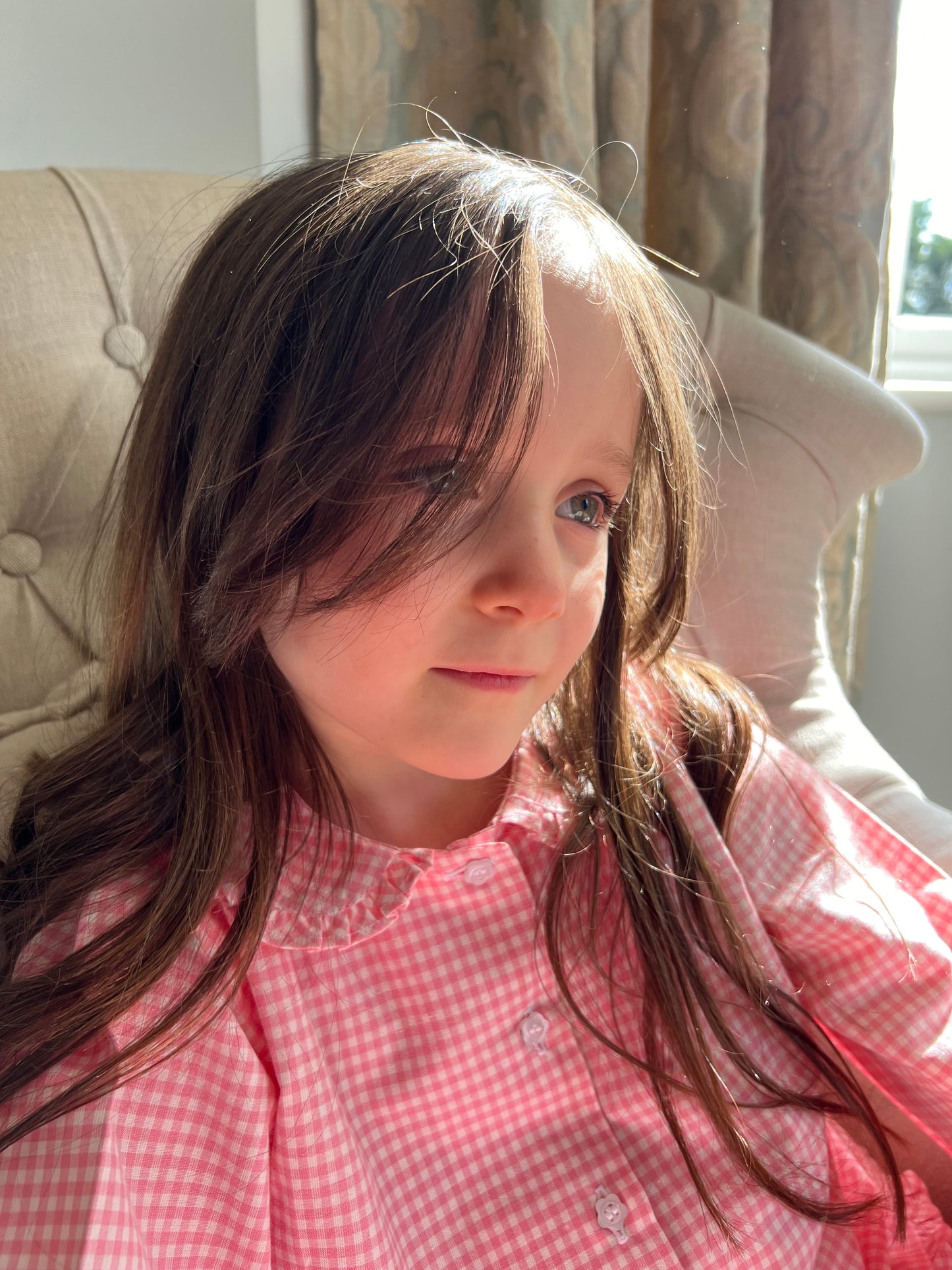 A girl wearing Cotton Candy pink gingham cotton pyjamas by TurQuaz