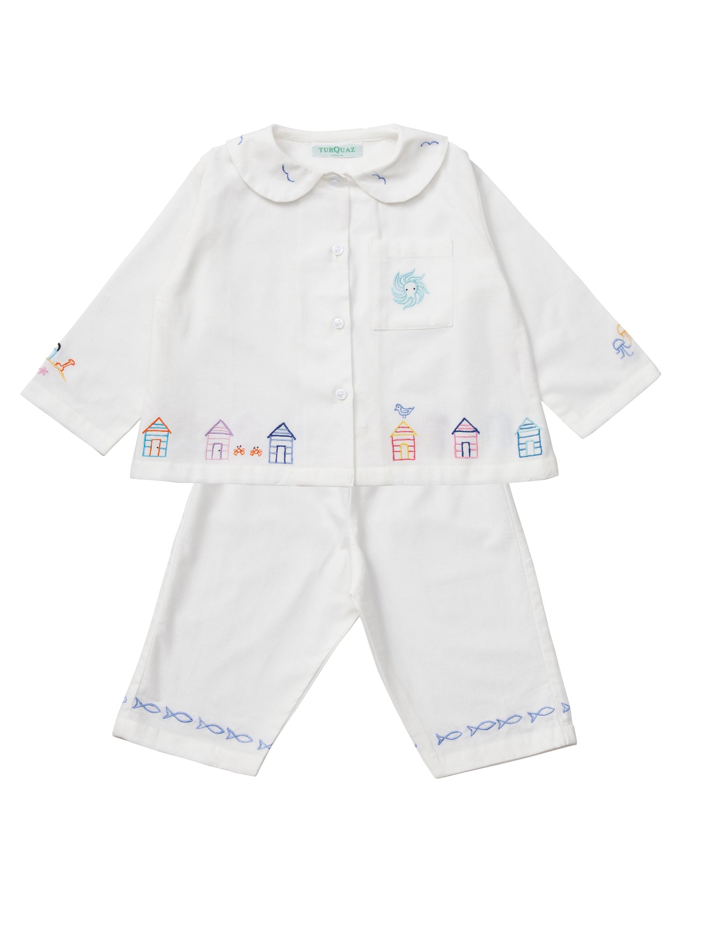 White cotton children's cropped pyjamas with a seaside theme.