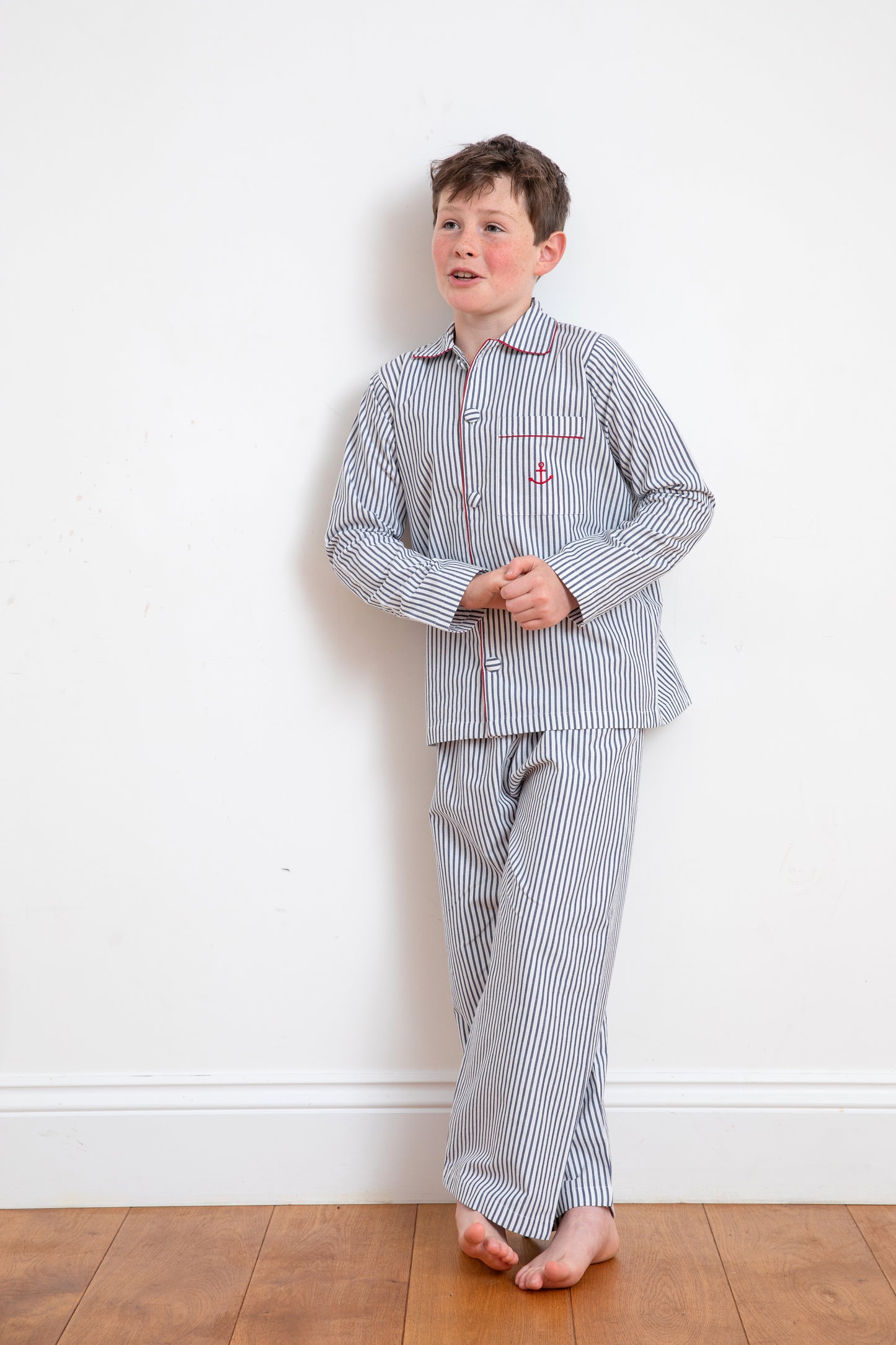 A handsome young man wearing convict pyjamas