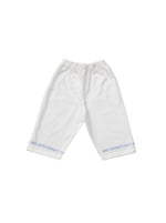 White cotton children's cropped pyjamas with a seaside theme.