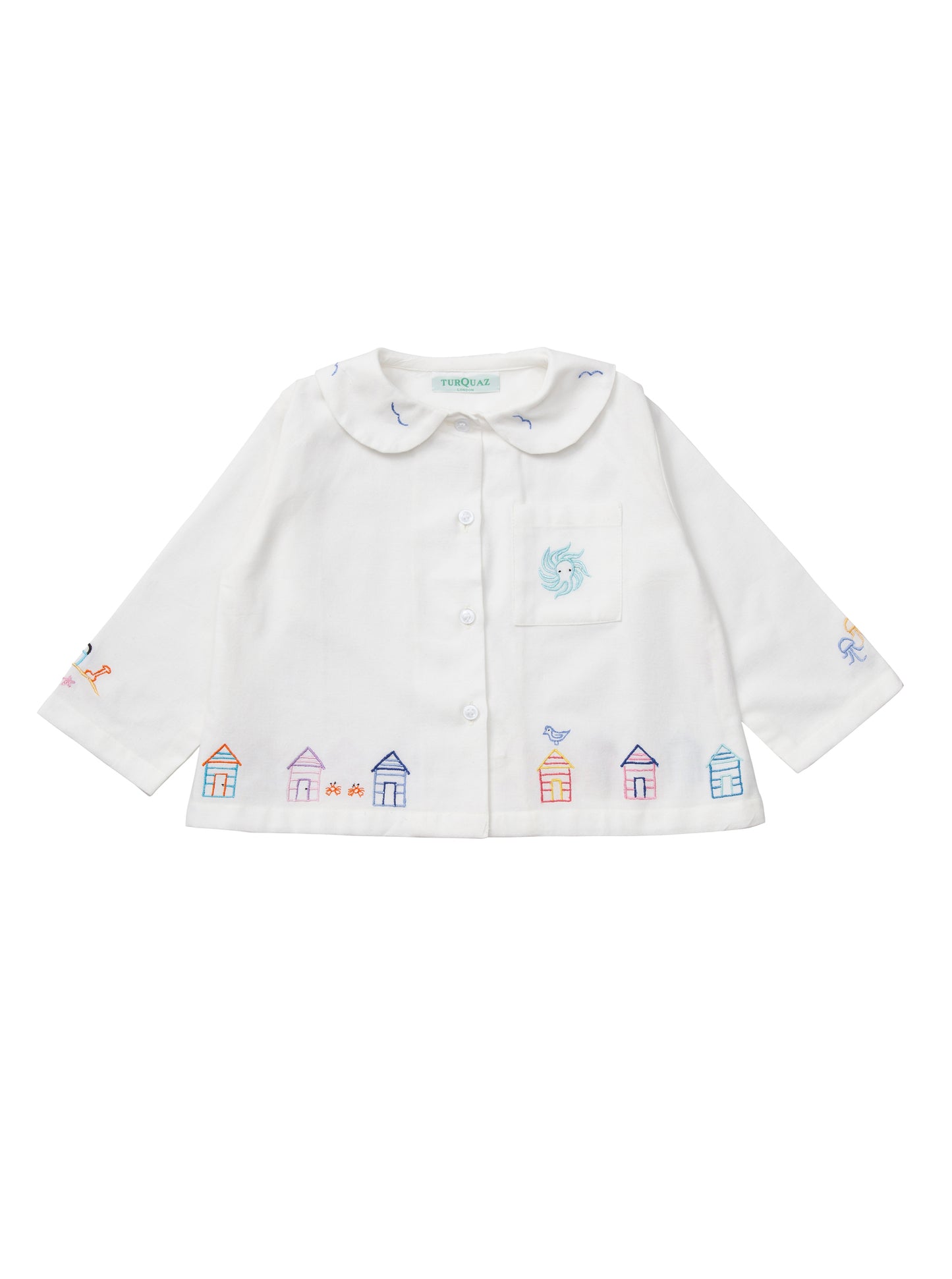 White cotton children's cropped pyjamas with a seaside theme.
