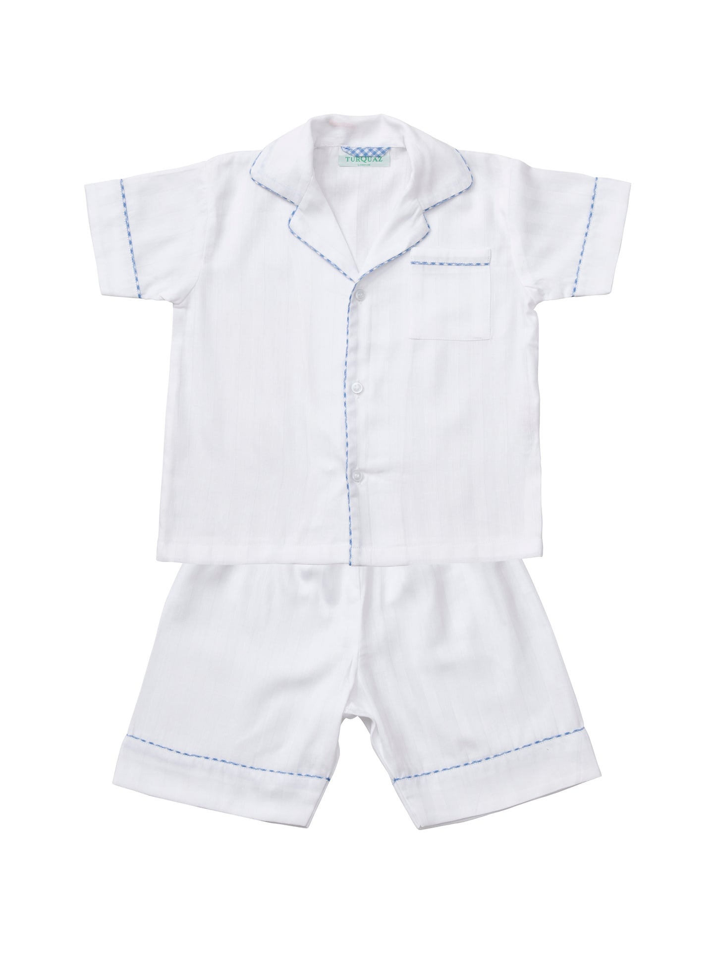 A classic white cropped pyjama set with blue gingham edging for children, from Turquaz.