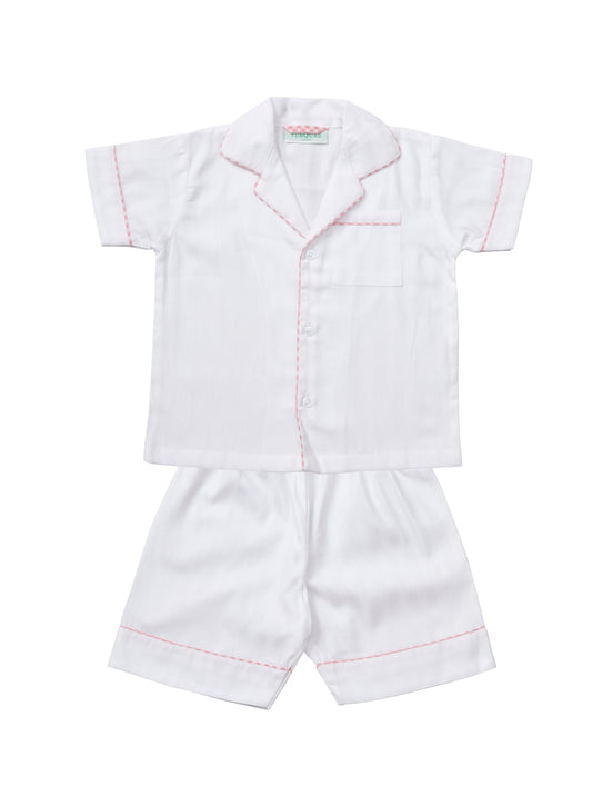 A classic white cropped pyjama with pink gingham edging for children, from Turquaz.
