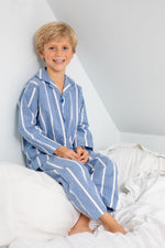 A child wearing classic cotton blue and chalk stripe pyjamas for kids by TurQuaz